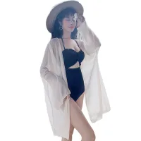 Swimsuit And Apricot Coat